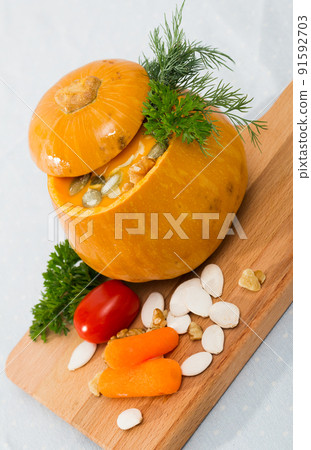 Recipe of squash soup in baked pumpkin 91592703