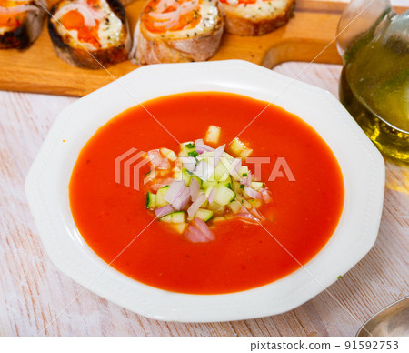 Andalusian cold soup gaspacho served with hot sandwiches 91592753