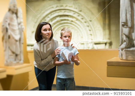 Woman and boy visiting sculptures exhibition Woman and boy visiting sculptures exhibition 91593101