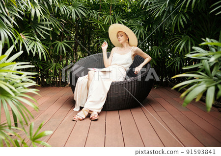 Creative Woman Sitting Outdoors 91593841