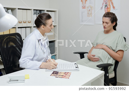 Pregnant woman having consultation with gynecologist Pregnant woman having consultation with gynecologist 91593992
