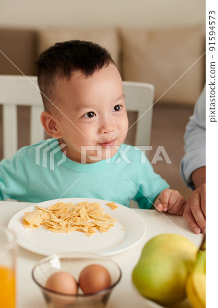 Boy Eating Corn Chips 91594573