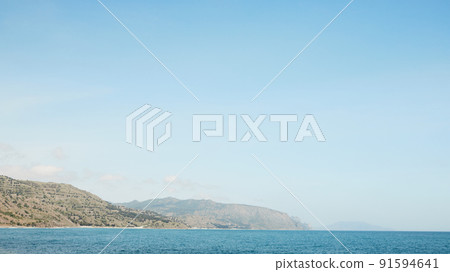 The sea and rocks on the south coast. Crimea, a landscape on a sunny day. Front view. The sea and rocks on the south coast. Crimea, a landscape on a sunny day. Front view. 91594641