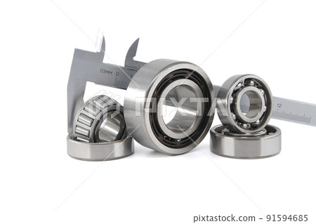 Group of roller bearings and caliper over white 91594685
