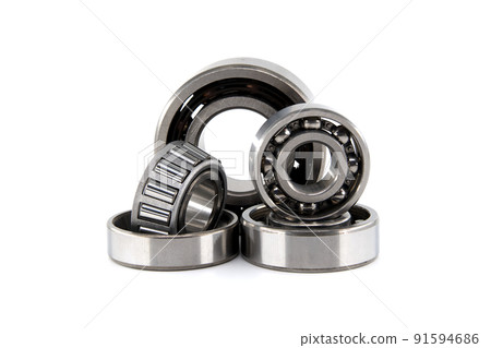 Group of various ball and roller bearings on white 91594686