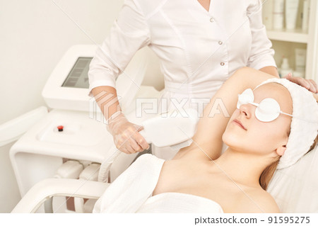 Laser hair removal treatment. Clinic skin care procedure. Medical dermatology Laser hair removal treatment. Clinic skin care procedure. Medical dermatology 91595275