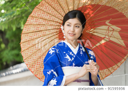 A kimono woman walking in the city of Kyoto A kimono woman walking in the city of Kyoto 91595936