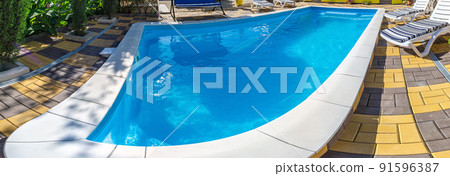 Abstract Pool with blue water background. Top view of swimming pool and floor texture. Panorama of pool bottom with tile pattern and transparent water. Summer travel and vacation background concept 91596387