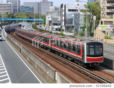 Osaka Metro 30000 series train running near Senri Chuo Station 91596848