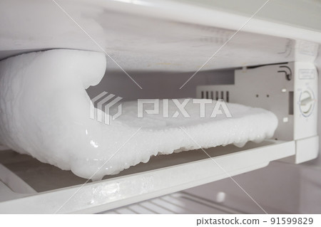 frozen Ice buildup in the freezer of refrigerator frozen Ice buildup in the freezer of refrigerator 91599829