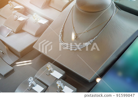 jewelry diamond shop with rings and necklaces luxury retail store window display jewelry diamond shop with rings and necklaces luxury retail store window display 91599847