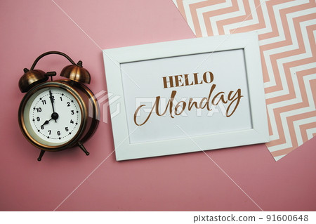 Hello Monday and Alarm clock on pink background Hello Monday and Alarm clock on pink background 91600648