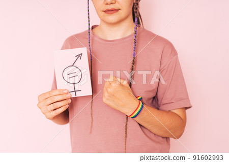 Girl with an LGBT bracelet on her hand shows sign of gender equality 91602993