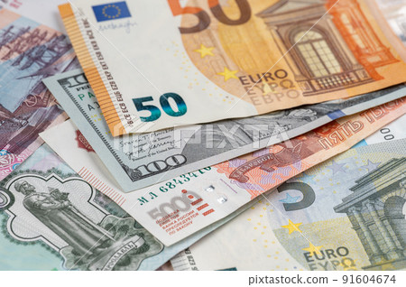 Money from different countries: dollars, euros, rubles. International currencies background. 91604674