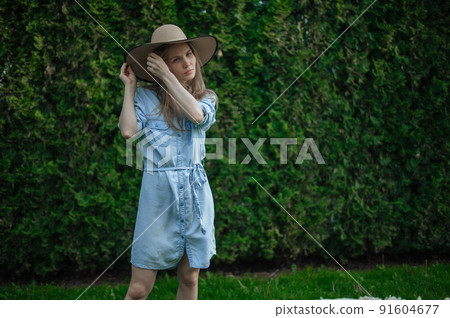 Romantic girl with hat on picnic in park 91604677