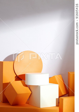 Front view of white and orange podium with and flower in a white background for advertising , abstract content 91605416