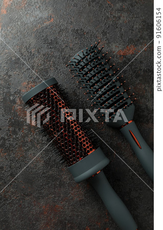 Hairbrushs on dark textured background, close up 91606154