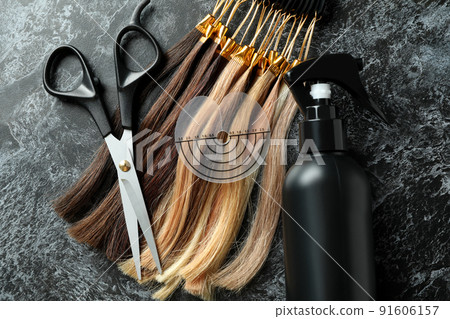 Composition with hair extension accessories on dark background 91606157