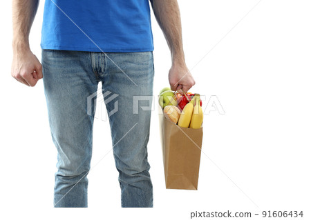 Delivery man holds bag with food, isolated on white background 91606434