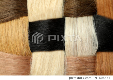 Different color female hair on whole background, close up 91606455