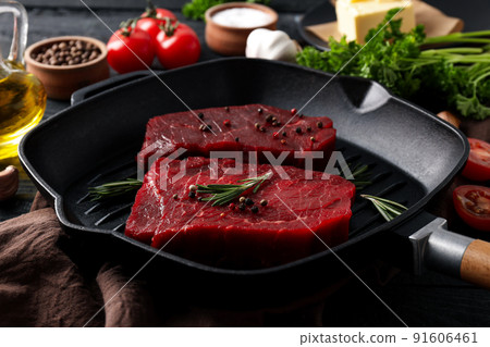 Concept of tasty food with raw beef steaks, close up Concept of tasty food with raw beef steaks, close up 91606461
