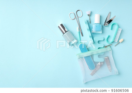 Concept of nail care with manicure accessories on blue background 91606506