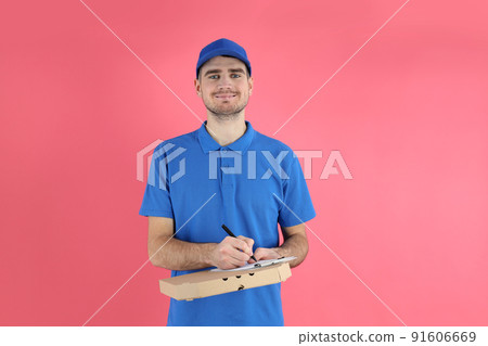 Delivery man with pizza and clipboard on pink background 91606669