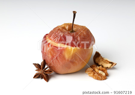 Concept of tasty food with baked apple on white background Concept of tasty food with baked apple on white background 91607219