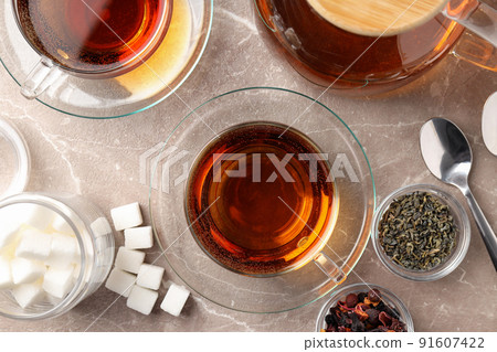 Concept of hot drink with tea on beige textured background 91607422