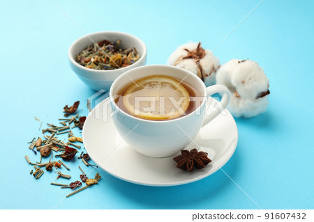 Concept of hot drink with tea on blue background 91607432