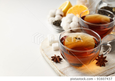 Concept of hot drink with tea on white background Concept of hot drink with tea on white background 91607437