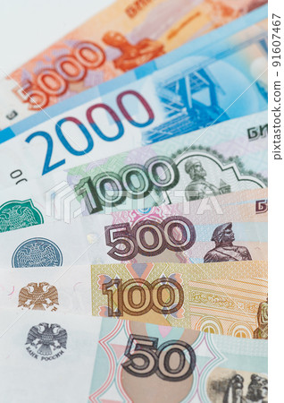Russian rubles background. Money background and texture. Banknotes of different denominations Russian rubles background. Money background and texture. Banknotes of different denominations 91607467