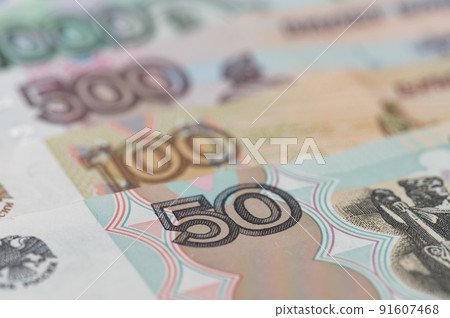 Russian rubles background. Money background and texture. Banknotes of different denominations Russian rubles background. Money background and texture. Banknotes of different denominations 91607468