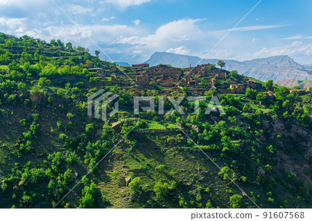 ruins of houses on a mountainside in Kurib, a depopulated village with the only remaining household with an apiary, Dagestan ruins of houses on a mountainside in Kurib, a depopulated village with the only remaining household with an apiary, Dagestan 91607568