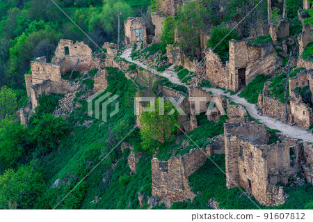 aerial view of the former street among the ruins in the abandoned mountain village of gamsutl in Dagestan 91607812