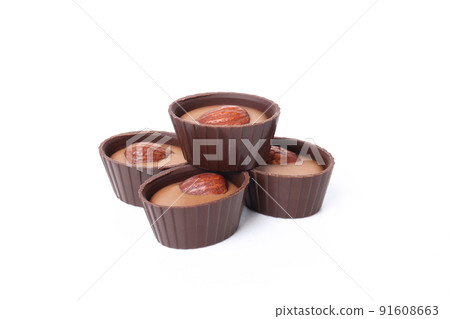 Chocolate candies with almond isolated on white background Chocolate candies with almond isolated on white background 91608663