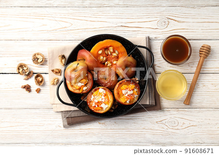 Concept of tasty food with baked apples on white wooden table 91608671