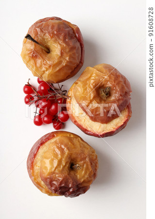 Concept of tasty food with baked apples on white background Concept of tasty food with baked apples on white background 91608728