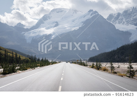 Alpine highway leading to the massive mountain with snow and glaciers, Jasper, Canada Alpine highway leading to the massive mountain with snow and glaciers, Jasper, Canada 91614623