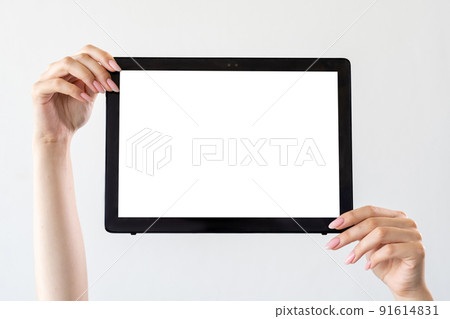 Mobile technology. Digital information. Advertising background. Female hands holding tablet computer with blank screen isolated white. Mobile technology. Digital information. Advertising background. Female hands holding tablet computer with blank screen isolated white. 91614831