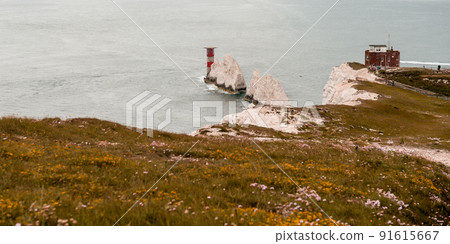 The Needles Isle of Wight. White chalk cliffs. White mountains with light house in the see 91615667