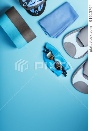 Set for training and learning to swim in the pool and open water on a blue background Set for training and learning to swim in the pool and open water on a blue background 91615764