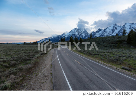 Scenic Road surrounded by Mountains and Trees in American Landscape. Scenic Road surrounded by Mountains and Trees in American Landscape. 91616209