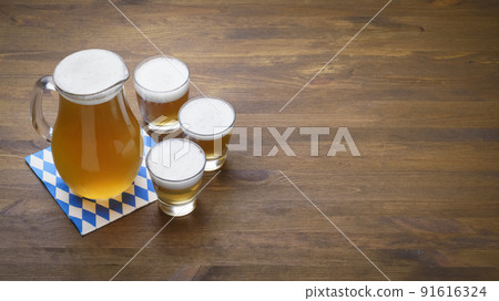 Banner Oktoberfest beer in a jug and glasses Banner Oktoberfest beer in a jug and glasses 91616324