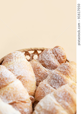 freshly baked croissants with powdered sugar 91617050