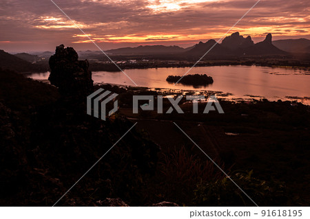 Panorama dramatic silhouette mountain landscape at sunset in the sea nature background Panorama dramatic silhouette mountain landscape at sunset in the sea nature background 91618195