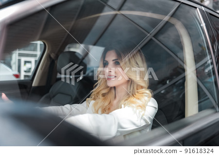 Beautiful woman driving a car. Beautiful woman driving a car. 91618324