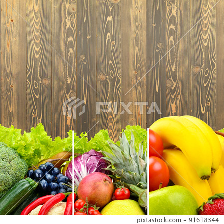 Vegetables and fruits on the background of wooden wall. 91618344