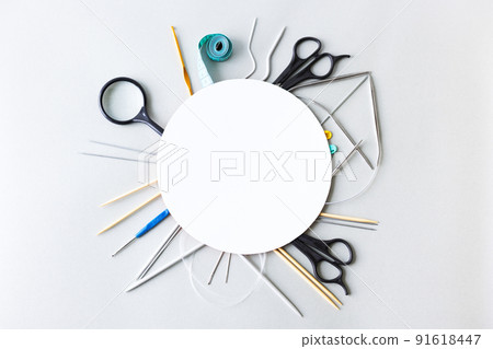 Knitting accessories, knitting hook, knitting needles, scissors, magnifying glass, needles, centimeter with space for text. Flat lay 91618447