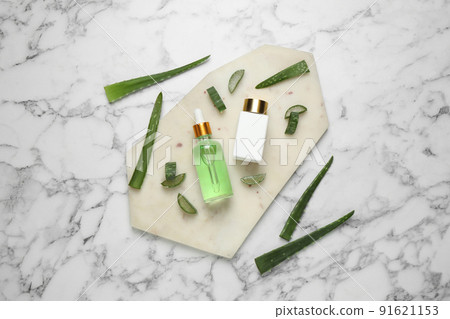 Flat lay composition with aloe vera and cosmetic products on white marble background Flat lay composition with aloe vera and cosmetic products on white marble background 91621153